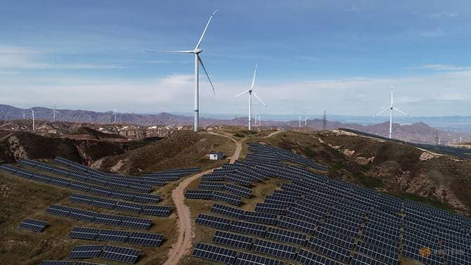 Wind turbines and solar panels are seen at a wind and solar power plant by State Power Investment Corporation (SPIC) in Zhangjiakou, Hebei province, China, Oct 29, 2018. (Photo: Reuters)